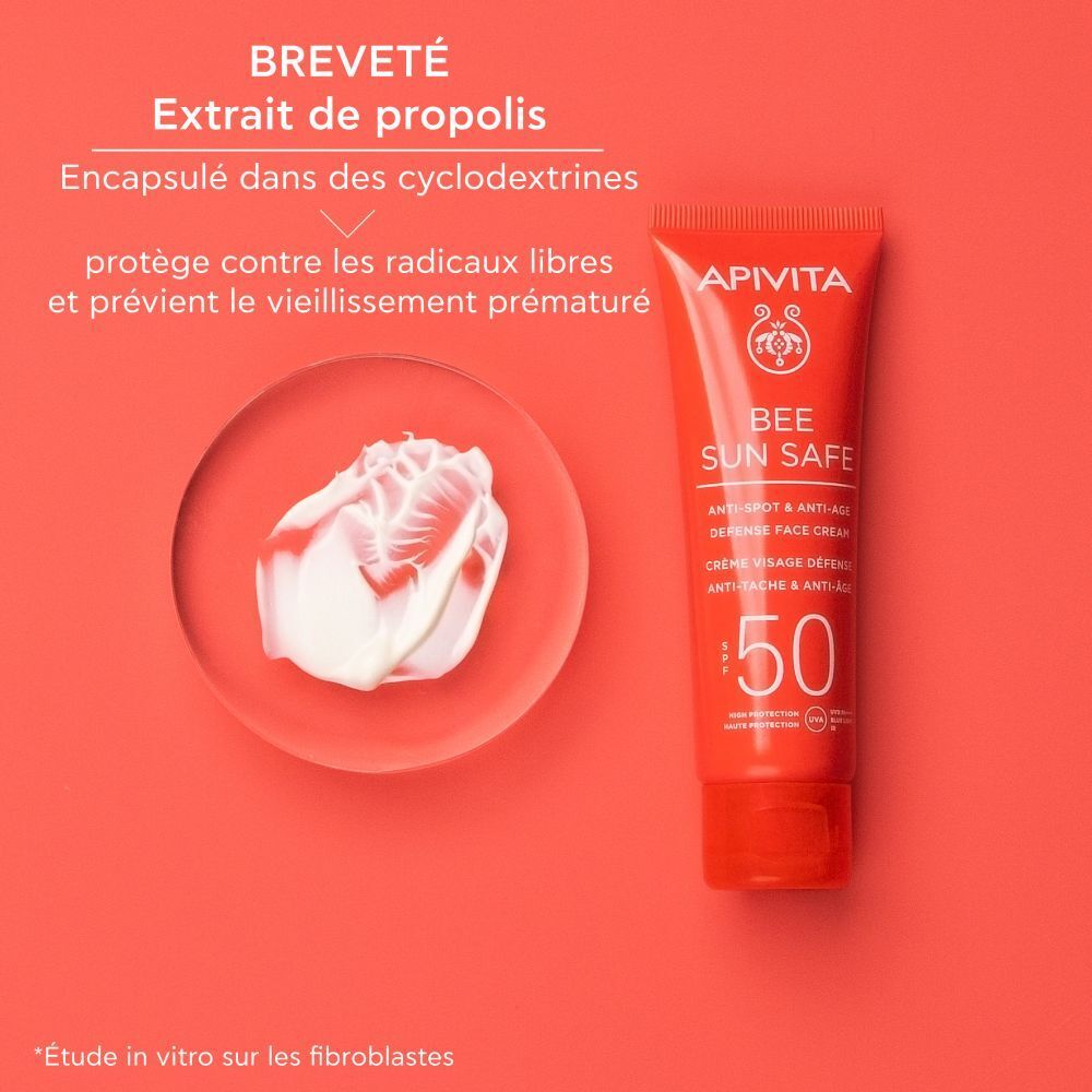 Texture crème. Tube rouge: Apivita Bee Sun Safe. Avec extrait de propolis.