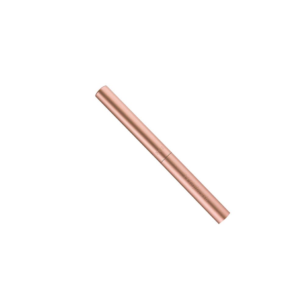 Pinceau à lèvres fermé, couleur or rose. Forme cylindrique. Design divisé.