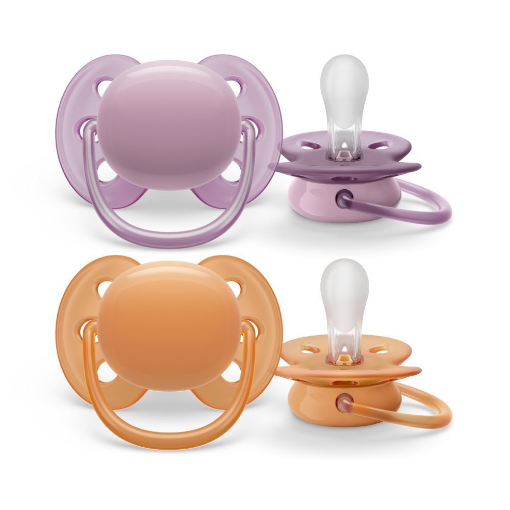 Quatre sucettes, deux couleurs: orange et violet. Tétines en silicone. Marque: Philips Avent.