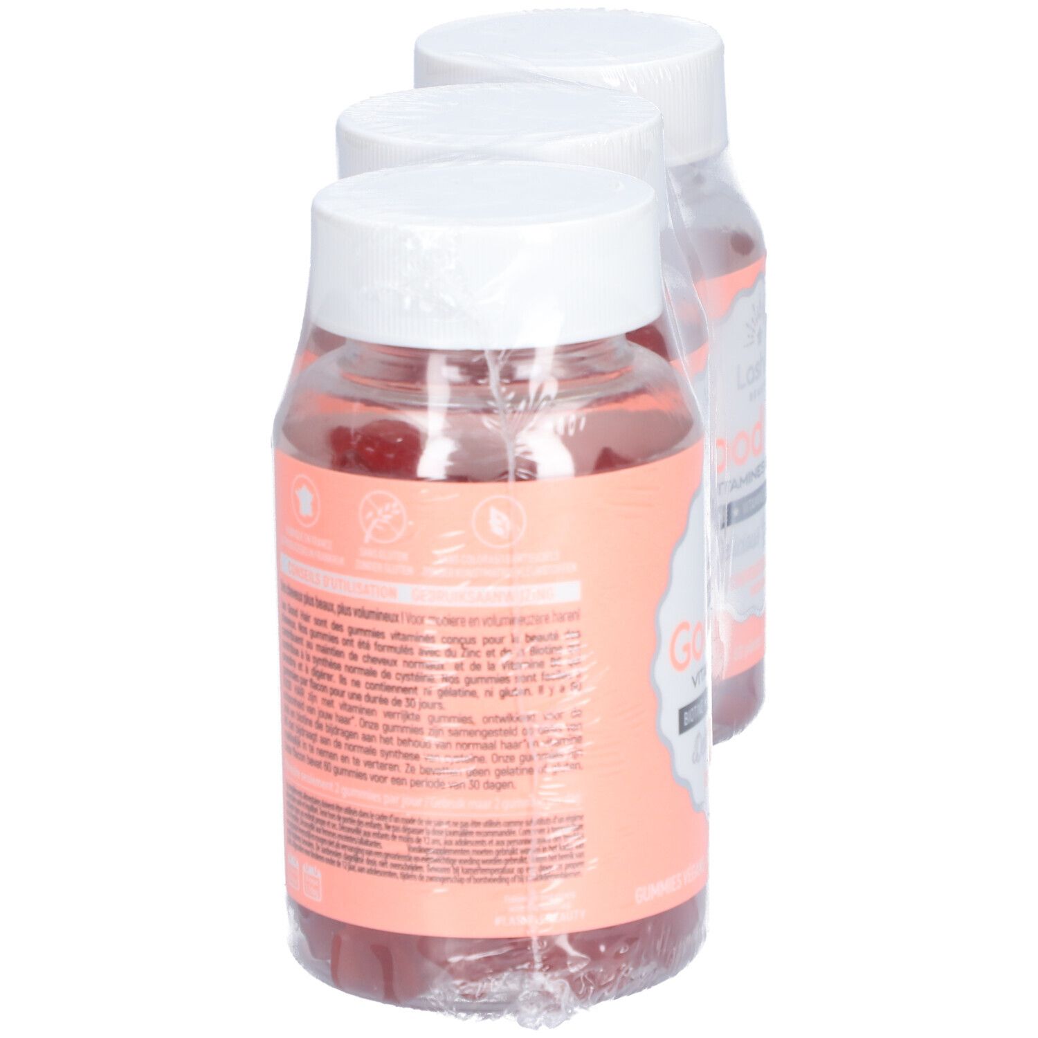 Deux flacons de gummies emballés. Inscription: Good Hair, Vitamines Boost. Étiquettes roses.