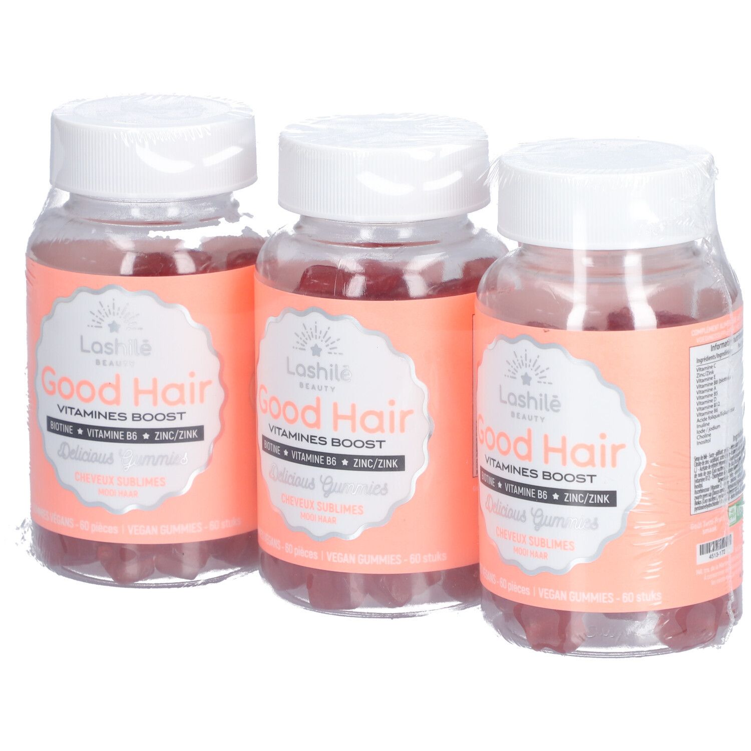 Trois flacons de gummies. Inscription: Good Hair, Vitamines Boost. Étiquettes roses. Emballé.