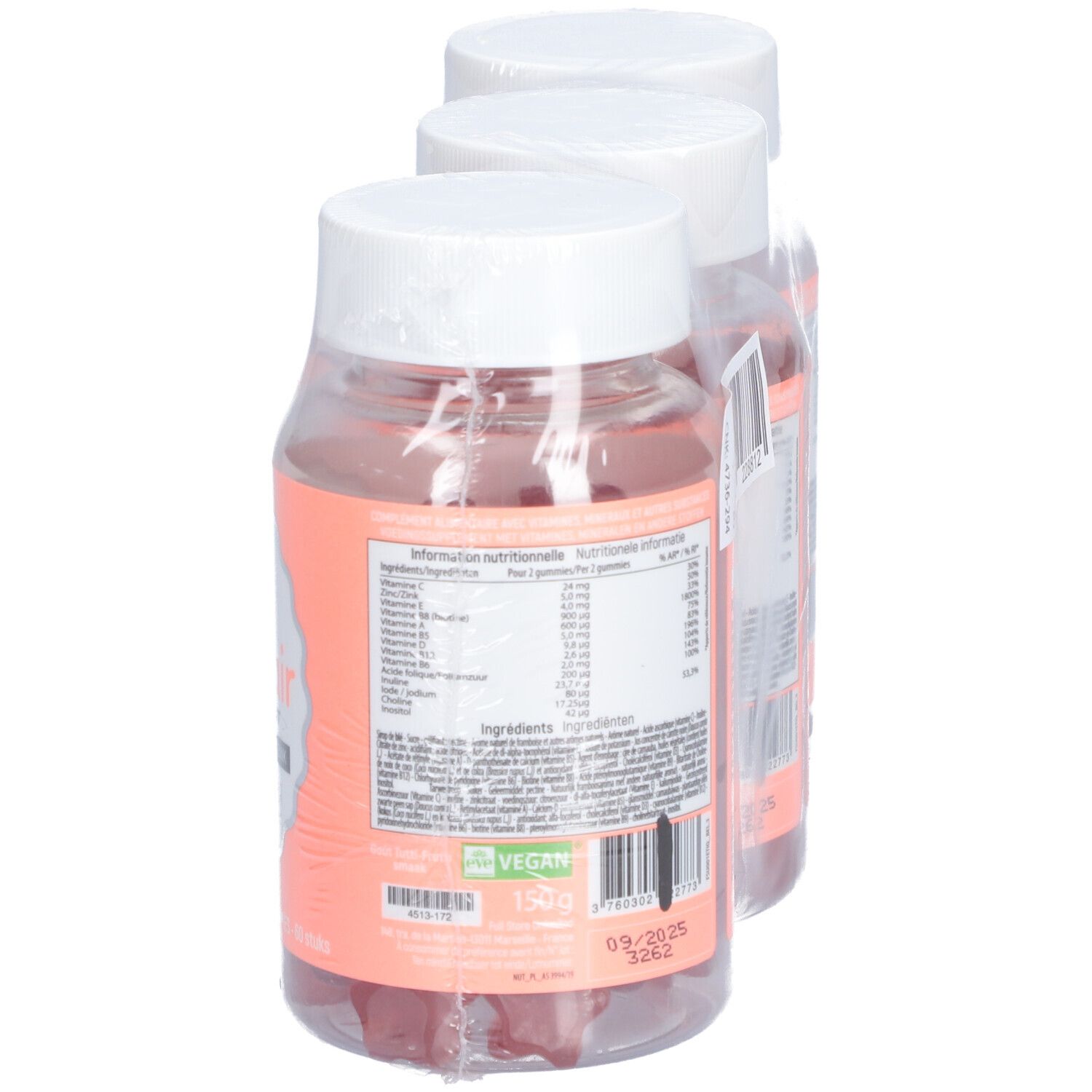 Trois flacons de gummies. Inscription: Good Hair, Vitamines Boost. Étiquettes roses. Texte au dos.