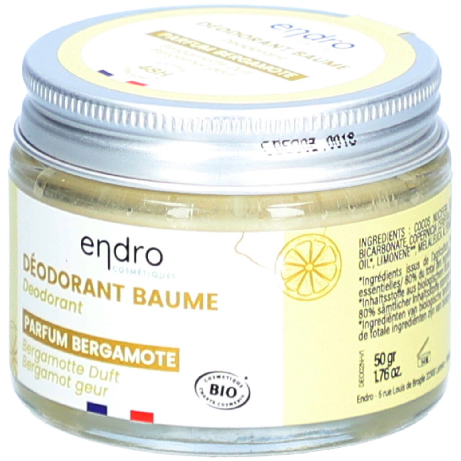 Baume déodorant en pot avec couvercle vissé. Inscription Parfum Bergamote, certification Bio.