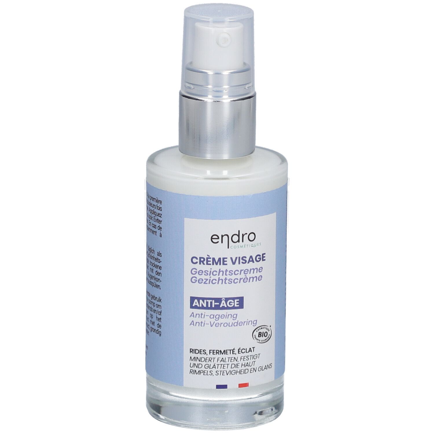 Crème visage avec pompe. Étiquettes bleues avec nom du produit, indication anti-âge et label bio. Drapeau français.