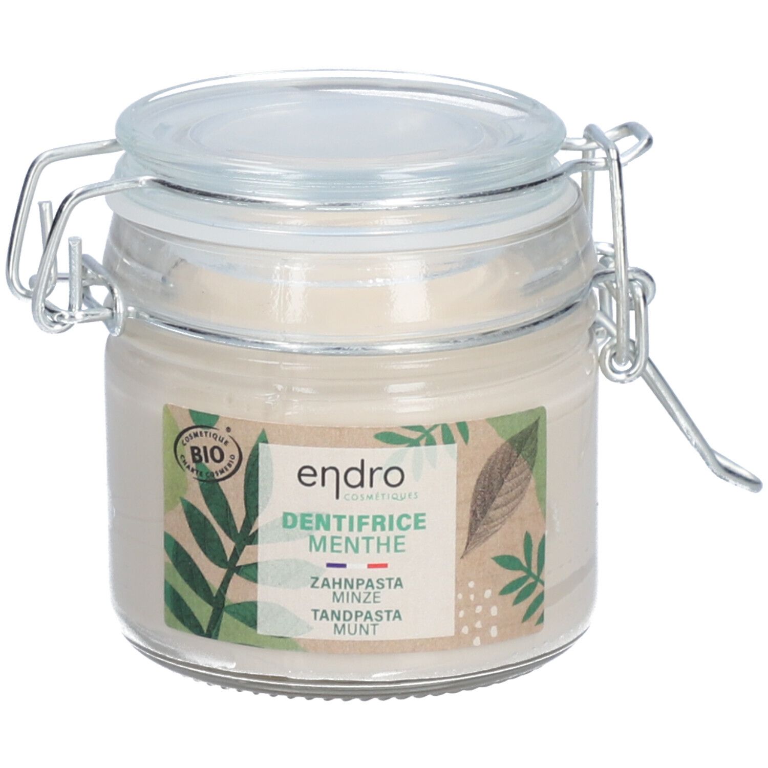 Glazen pot met tandpasta. Label met "endro", "DENTIFRICE MENTHE", bio-certificering en bladeren. Deksel met metalen sluiting.