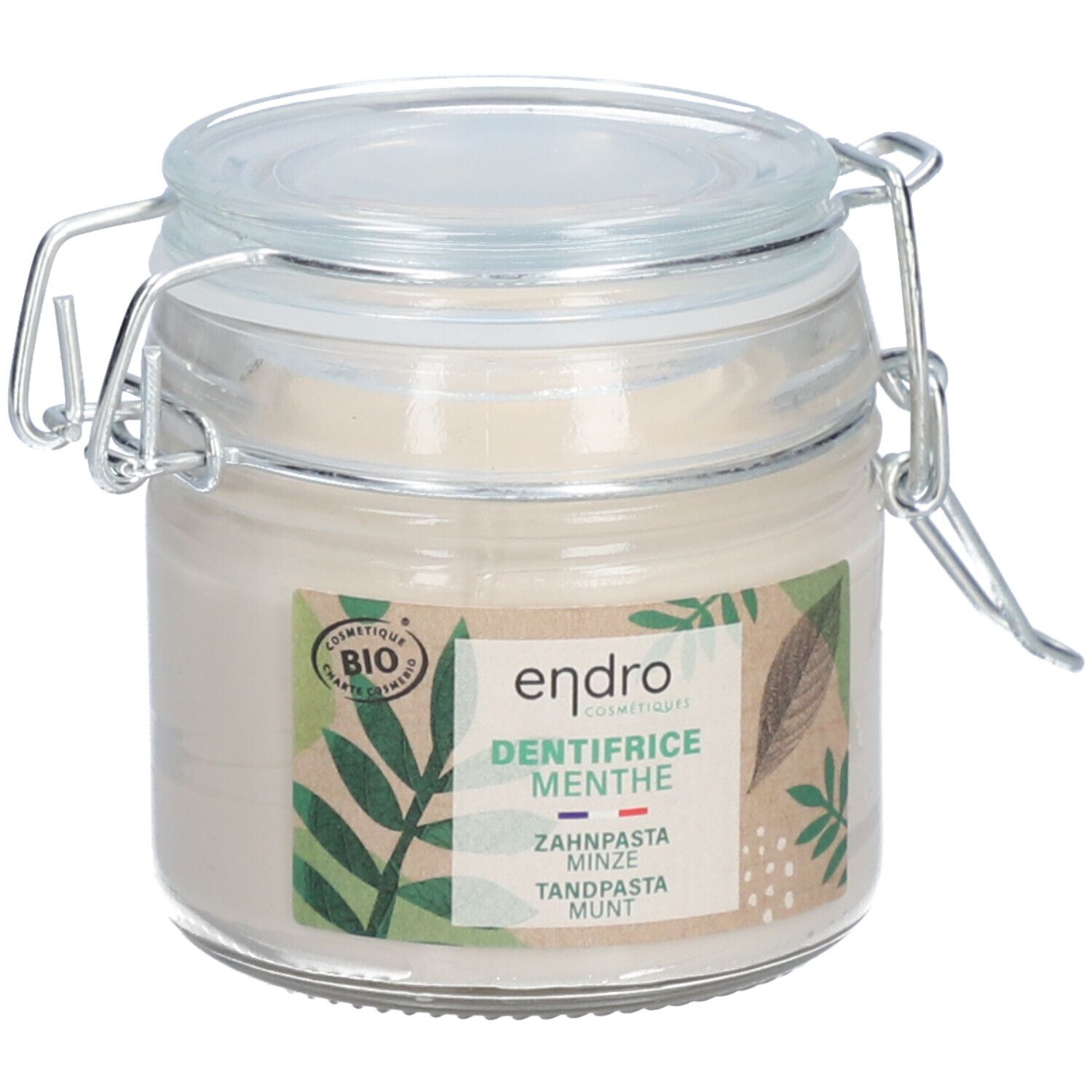 Glazen pot met tandpasta. Label met "endro", "DENTIFRICE MENTHE", bio-certificering en bladeren. Deksel met metalen sluiting.