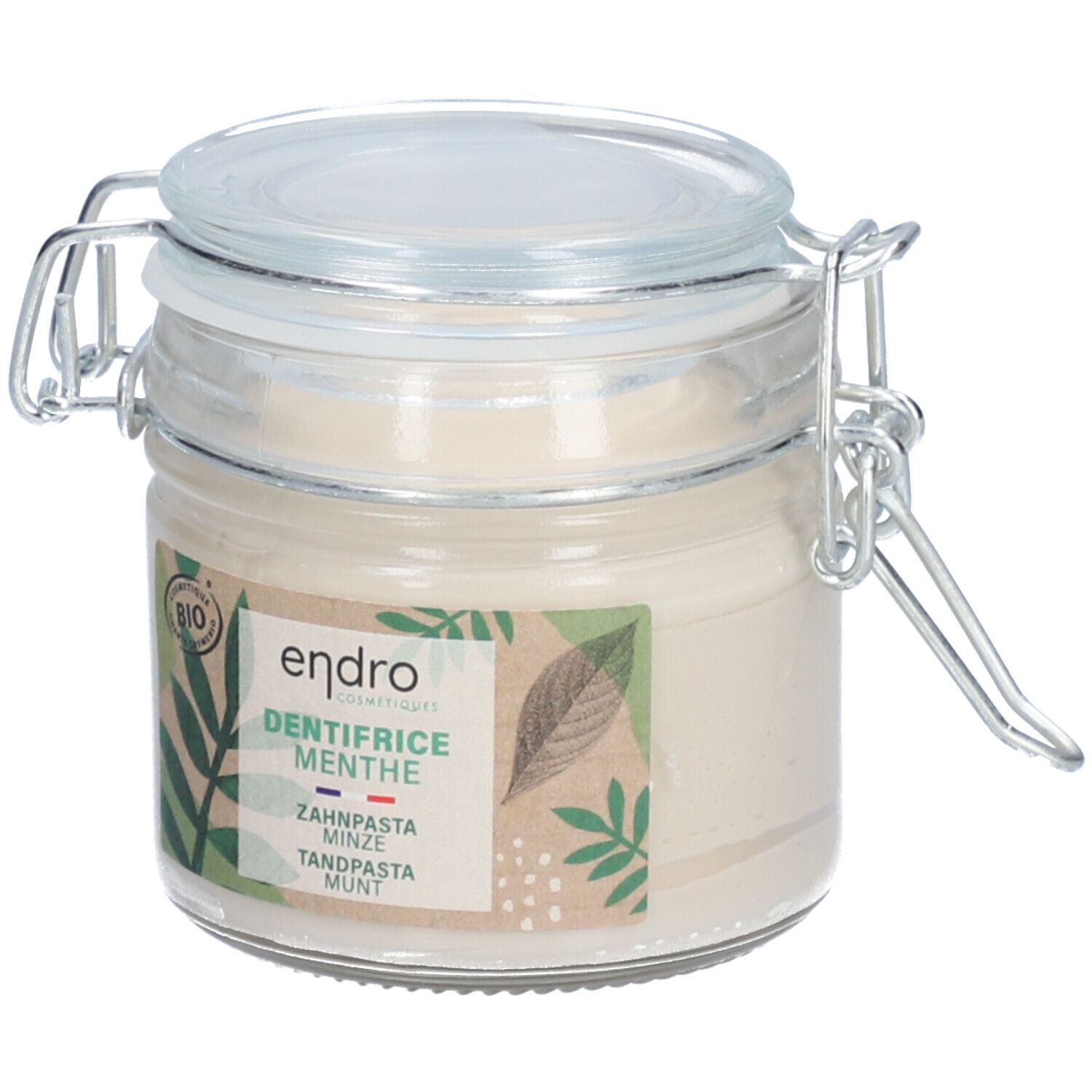 Glazen pot met tandpasta. Label met "endro", "DENTIFRICE MENTHE", bio-certificering en bladeren. Deksel met metalen sluiting.
