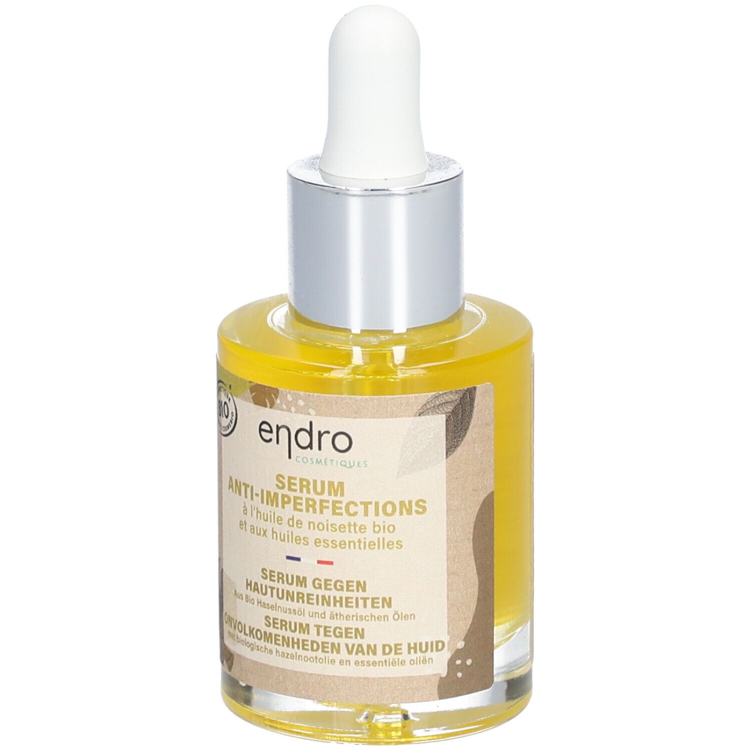 Serumflasche mit Pipette. Aufschrift: Endro, Anti-Imperfektionen. Bio-Siegel. Gelbe Flüssigkeit sichtbar.