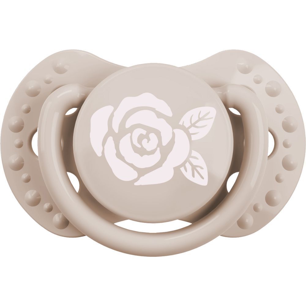 Sucette beige avec motif de rose. Marque : Difrax. Sucette dynamique.