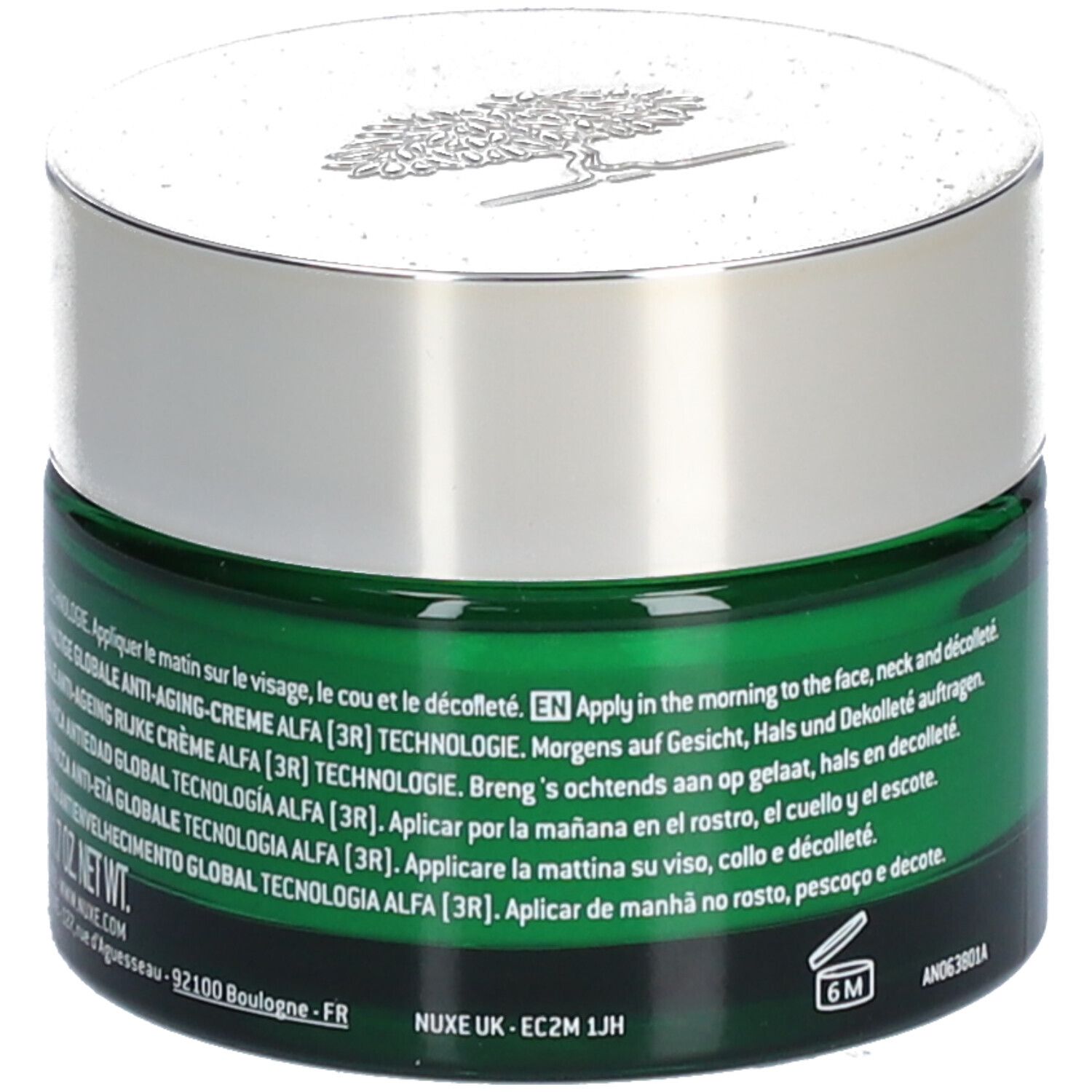 Pot de crème vert avec couvercle argenté. Inscription: Nuxuriance ULTRA, LA CRÈME RICHE ANTI-ÂGE GLOBAL. Texte multilingue. Symbole 6M.