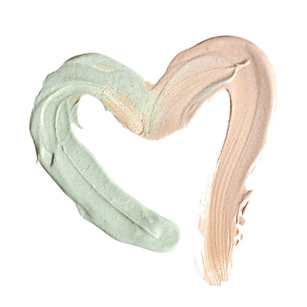 Hartvormige applicatie van groene en beige primer. Geen verpakking zichtbaar.