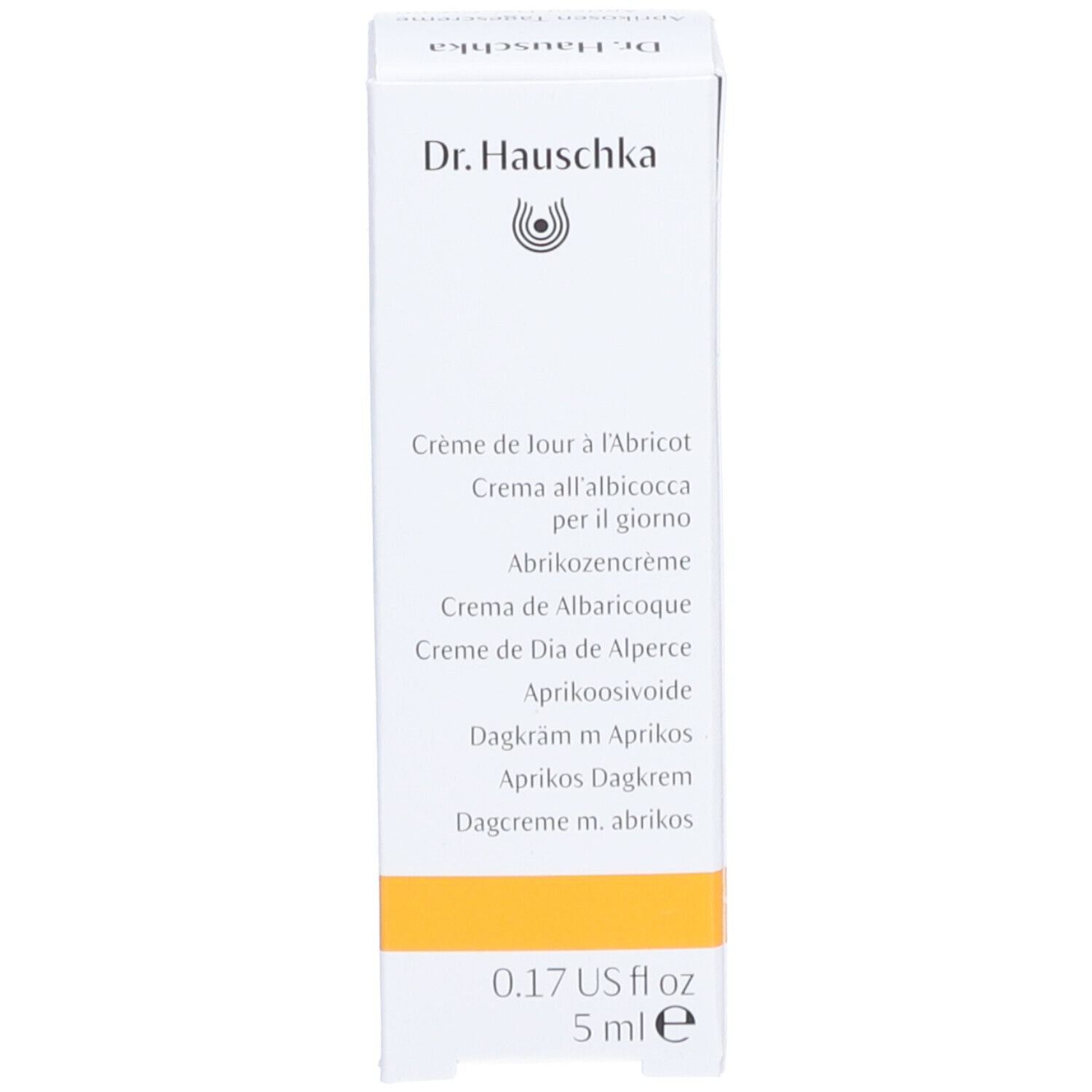Schachtel mit Produktnamen in mehreren Sprachen. Aufschrift: Dr. Hauschka, Aprikosen Tagescreme, 5 ml.