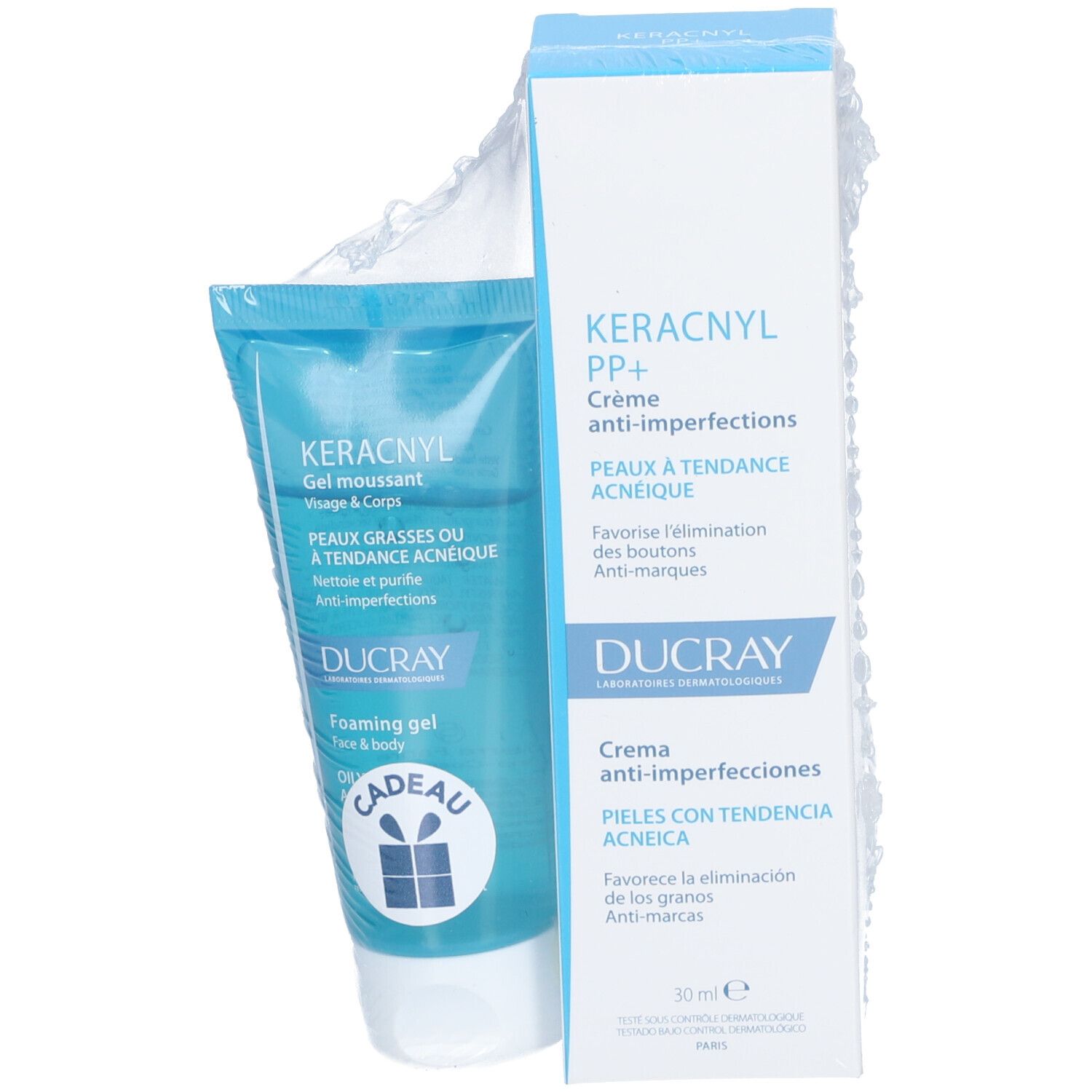 Blauwe en witte tube en doos. Op de tube staat "KERACNYL Gel moussant". Op de doos staat "KERACNYL PP+ Crème anti-imperfections".
