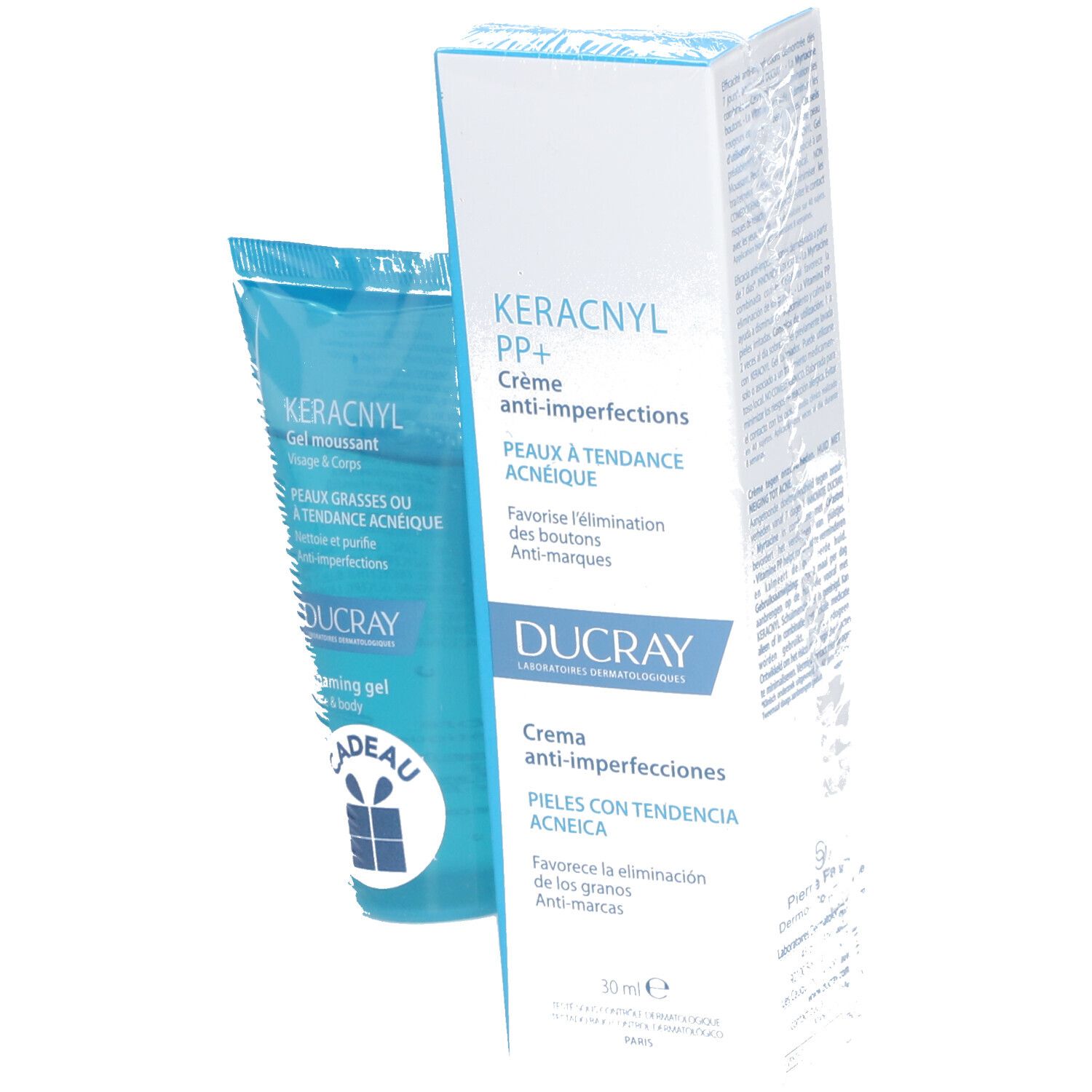 Blauwe en witte tube en doos. Op de tube staat "KERACNYL Gel moussant". Op de doos staat "KERACNYL PP+ Crème anti-imperfections".