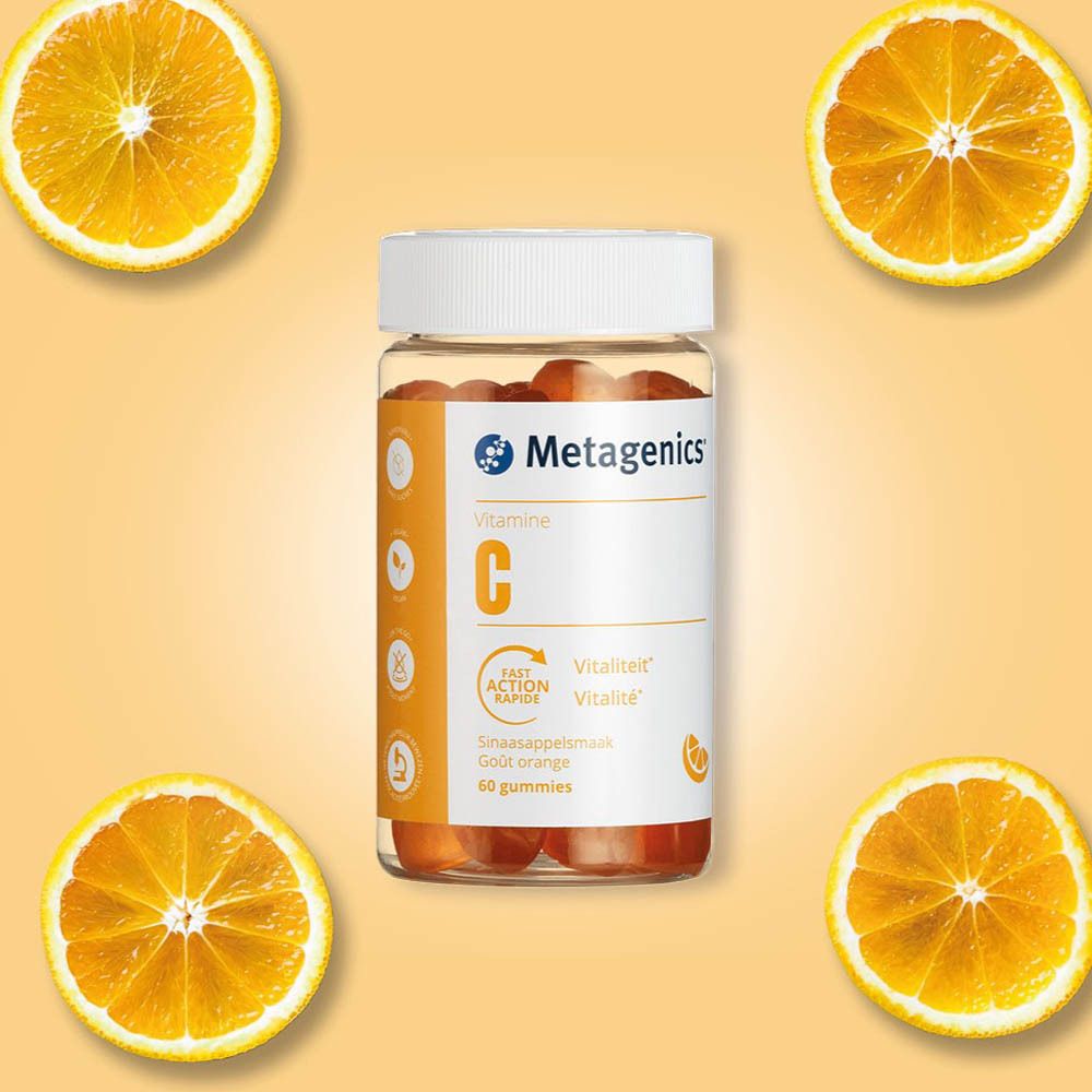Une bouteille de gommes à la vitamine C, entourée d'oranges. Marque Metagenics. Inscription : Vitamine C, 60 gommes.