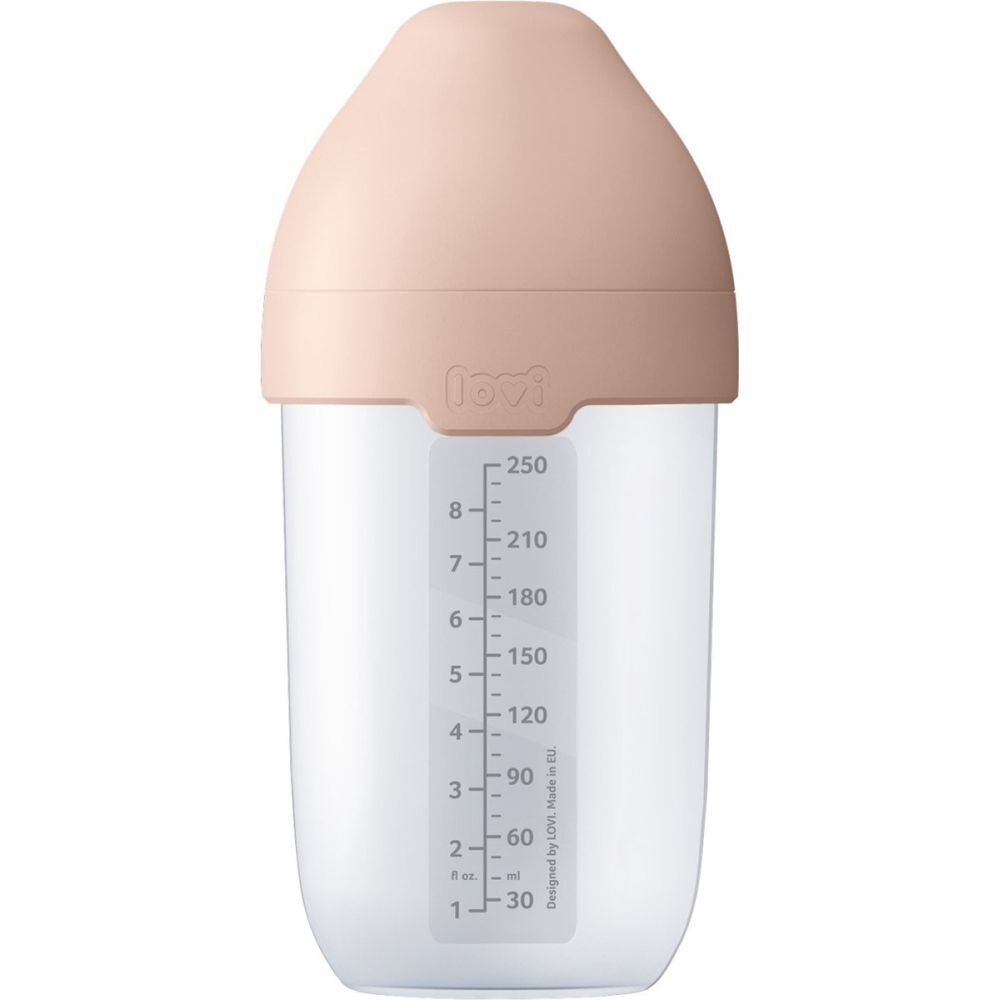 Biberon avec bouchon beige. Corps transparent. Échelle de mesure.