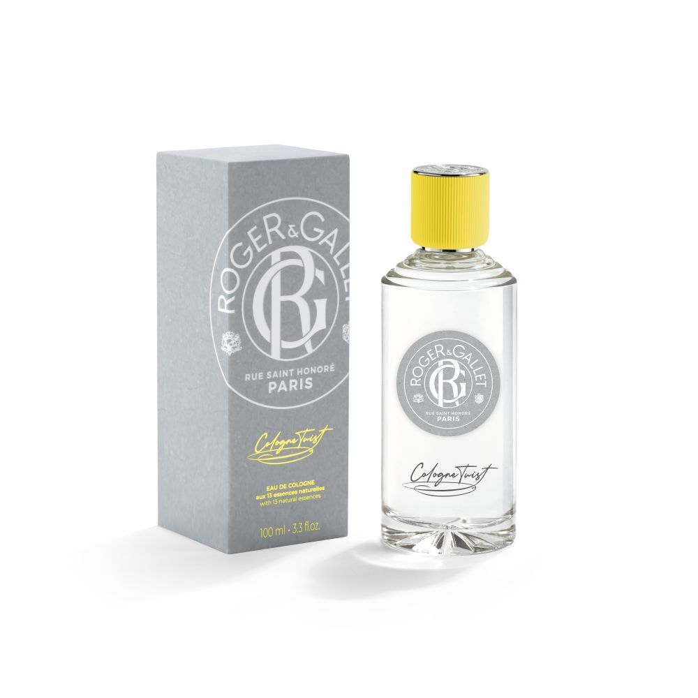 Fles en doos. Fles met gele dop, heldere vloeistof. Grijze doos met logo en tekst.
