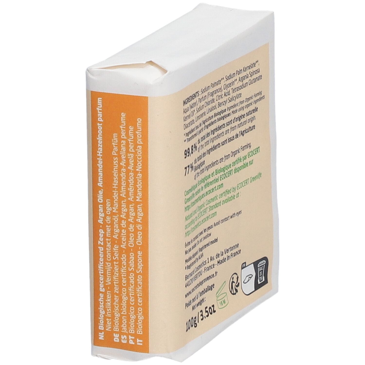 Seife in Papierverpackung. Text mit Inhaltsstoffen, Bio-Zertifizierung, Herstelleradresse, Gewicht und Warnhinweisen.
