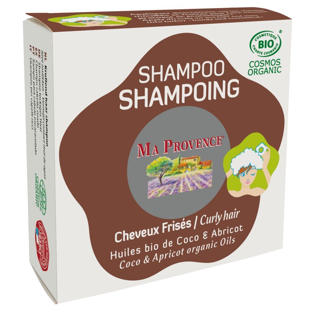 Boîte en carton avec texte. Inscription: Shampooing, Ma Provence, Cosmos Organic. Pour cheveux frisés. Huiles de coco et abricot.