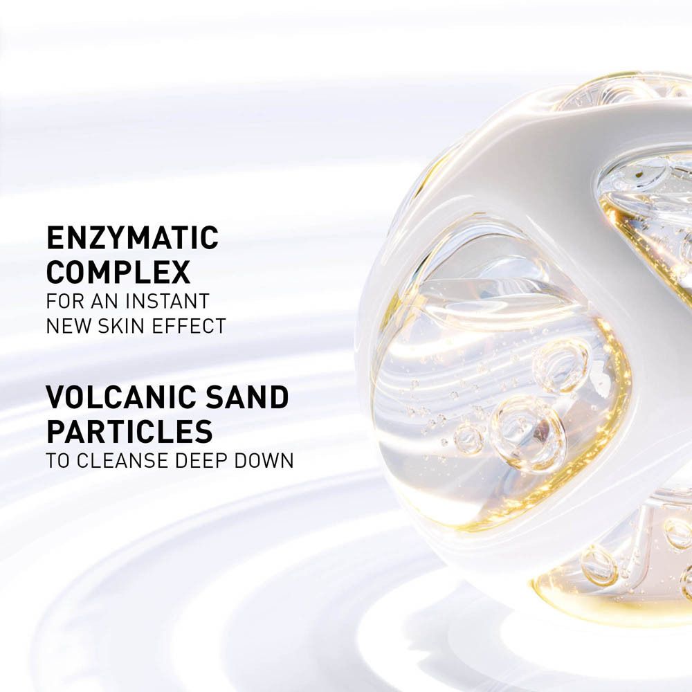 Gros plan sur des sphères transparentes et texte : Complexe enzymatique pour un nouvel effet peau instantané. Sable volcanique pour nettoyer en profondeur.