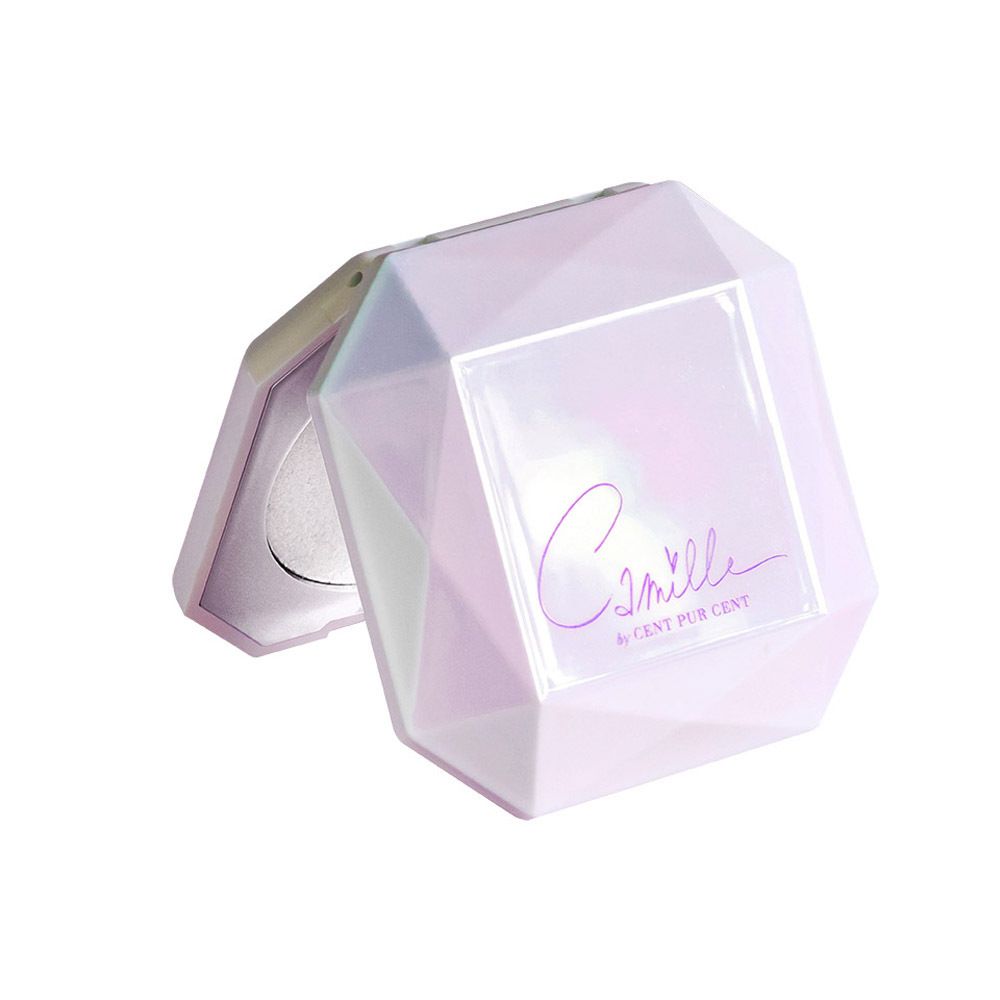 Highlighter cosmétique dans un compact blanc en forme de diamant avec miroir.