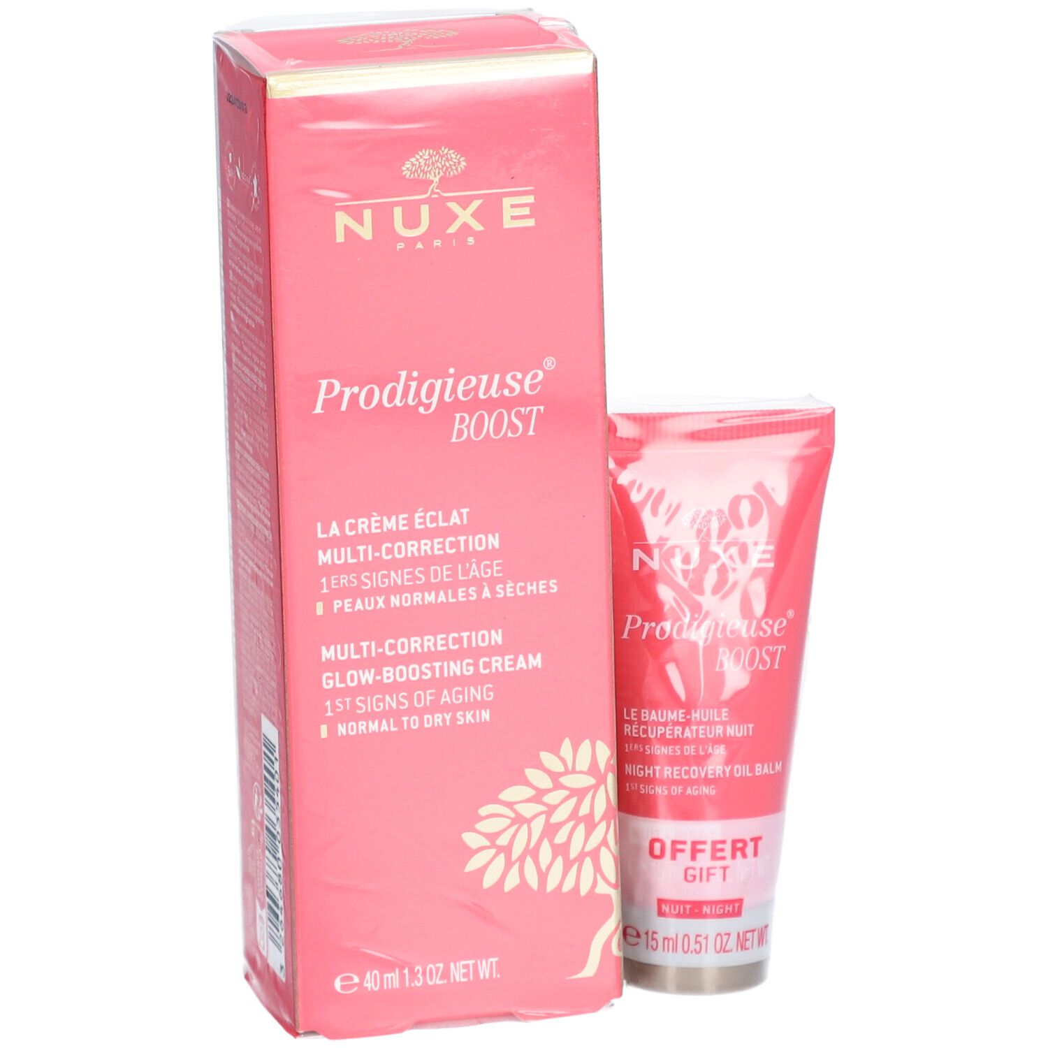 Boîte et tube roses. Inscription: Nuxe Prodigieuse Boost. Contient crème et baume de nuit. Cadeau gratuit. 15 ml.