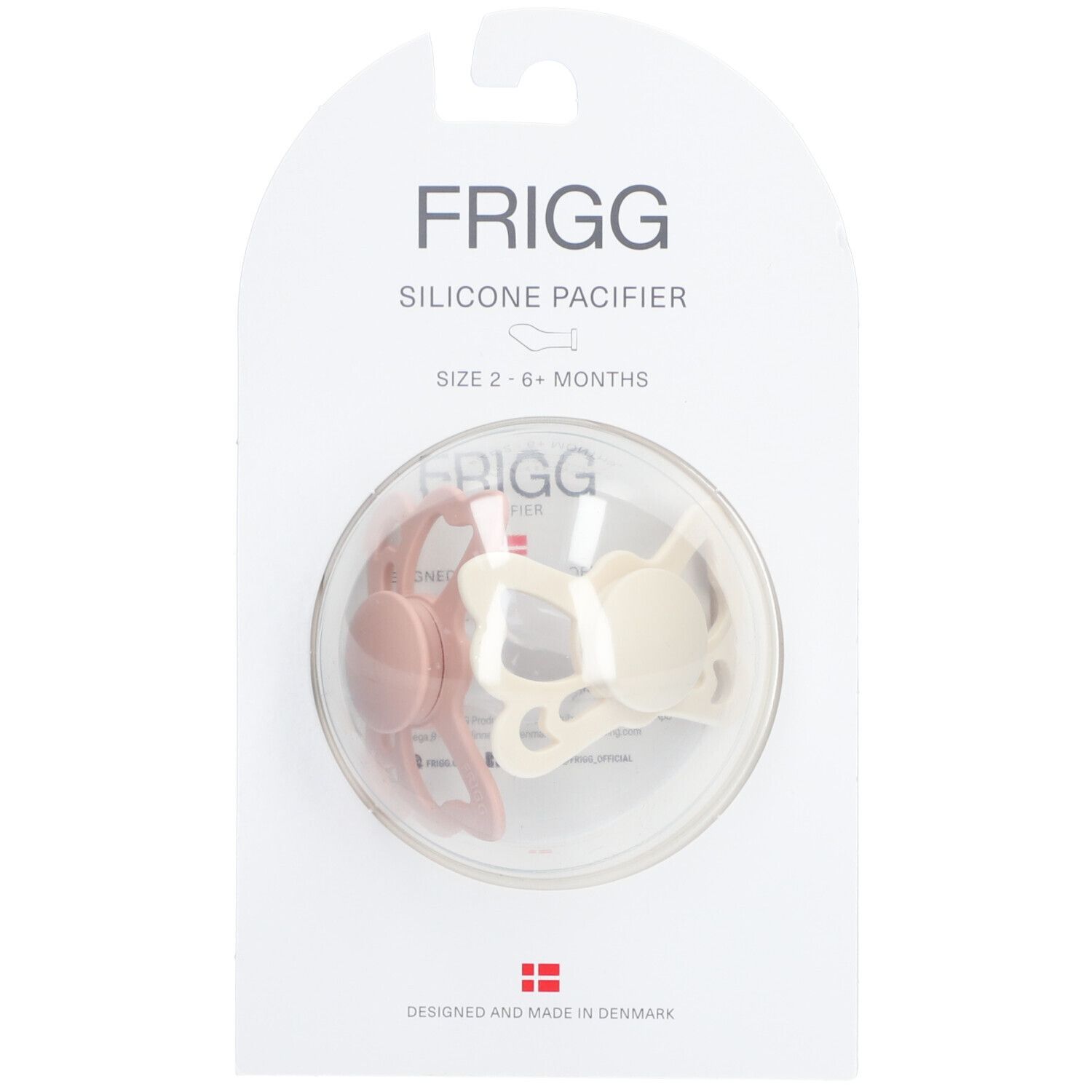 Zwei Schnuller in einer transparenten Verpackung. Marke FRIGG. Größe 2-6 Monate. Farben: Rosa und Creme.