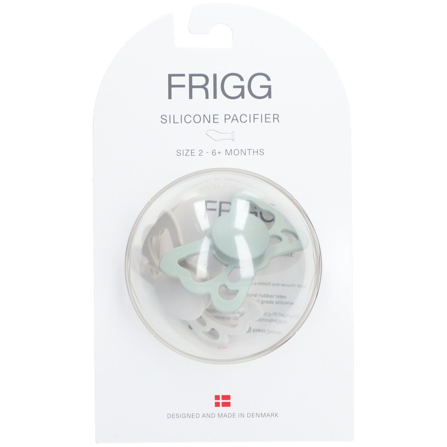Silikon-Schnuller in Verpackung. Hellgrüner Schmetterlings-Sauger in transparenter Blisterverpackung. Marke FRIGG.