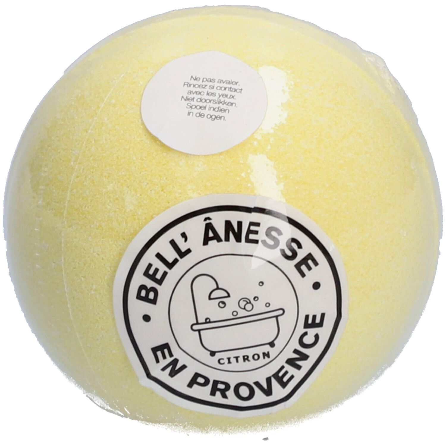 Boule de bain jaune, emballée. Étiquettes avec texte et logo: BELL' ANESSE EN PROVENCE CITRON. Contient des informations.