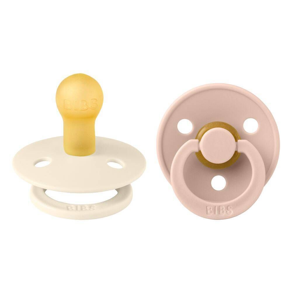 Deux sucettes BIBS. Ivoire et rose. Forme ronde. Tétine en latex.