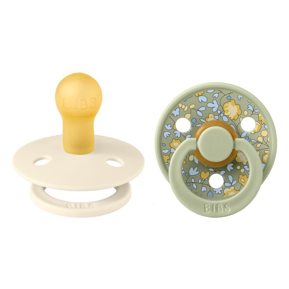 Zwei Schnuller. BIBS. Runde Form. Silikon-Sauger. Floral bedruckt. Beige und grün.