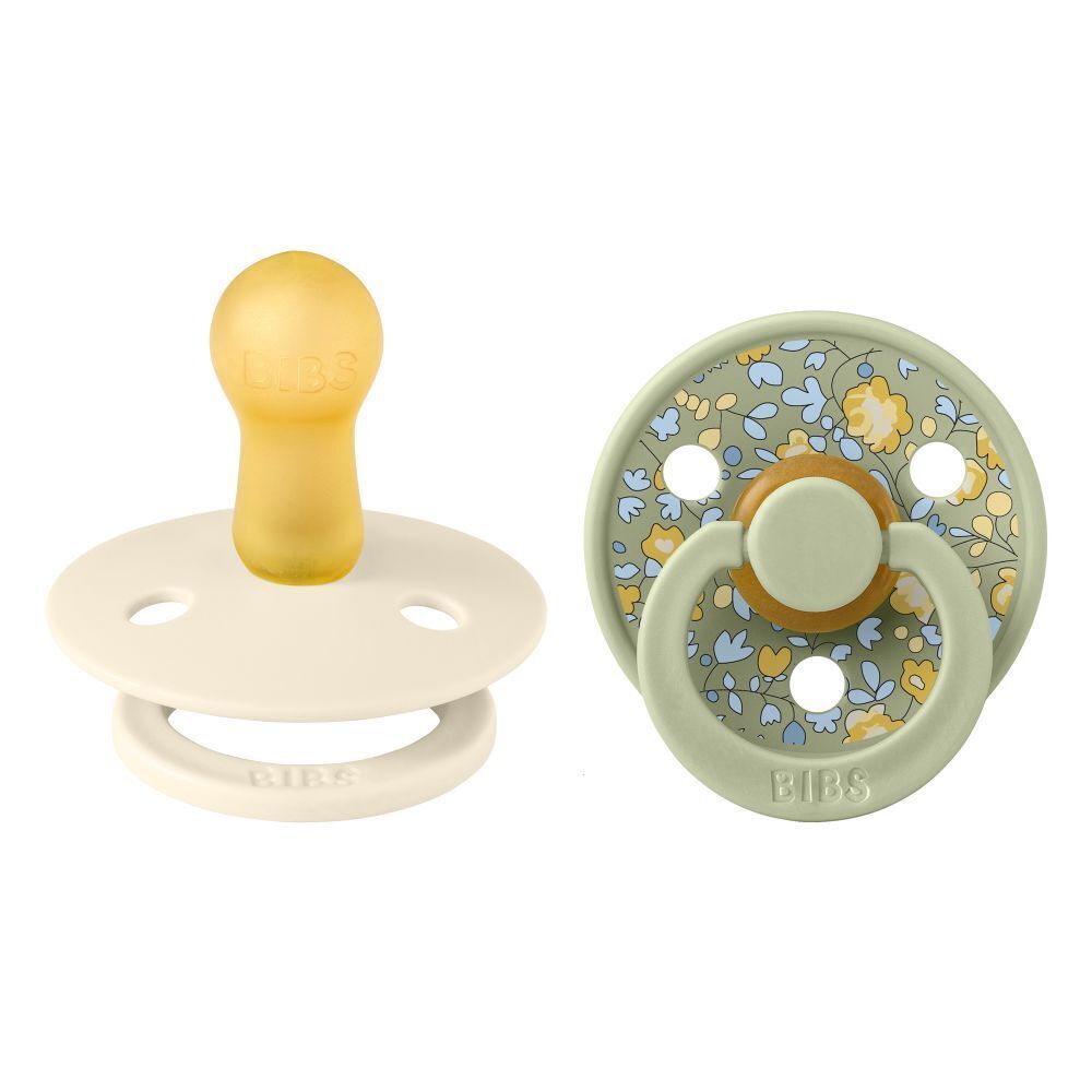 Deux sucettes. BIBS. Caoutchouc naturel. Motifs floraux. Forme ronde. Taille 2. Vert et crème.