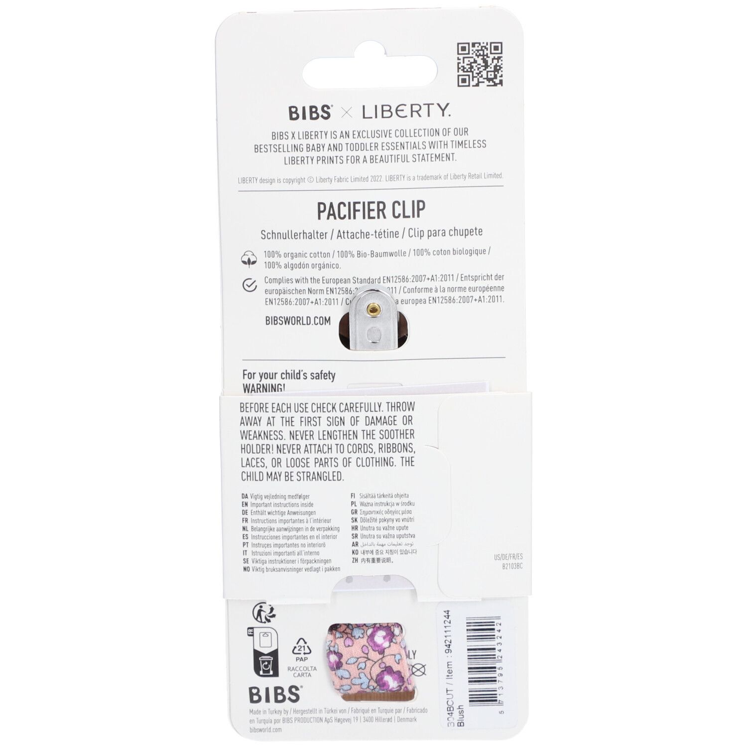 Rückseite der Verpackung mit Schnullerhalter. Text: BIBS x Liberty. Produktname: PACIFIER CLIP. Informationen und Warnhinweise.