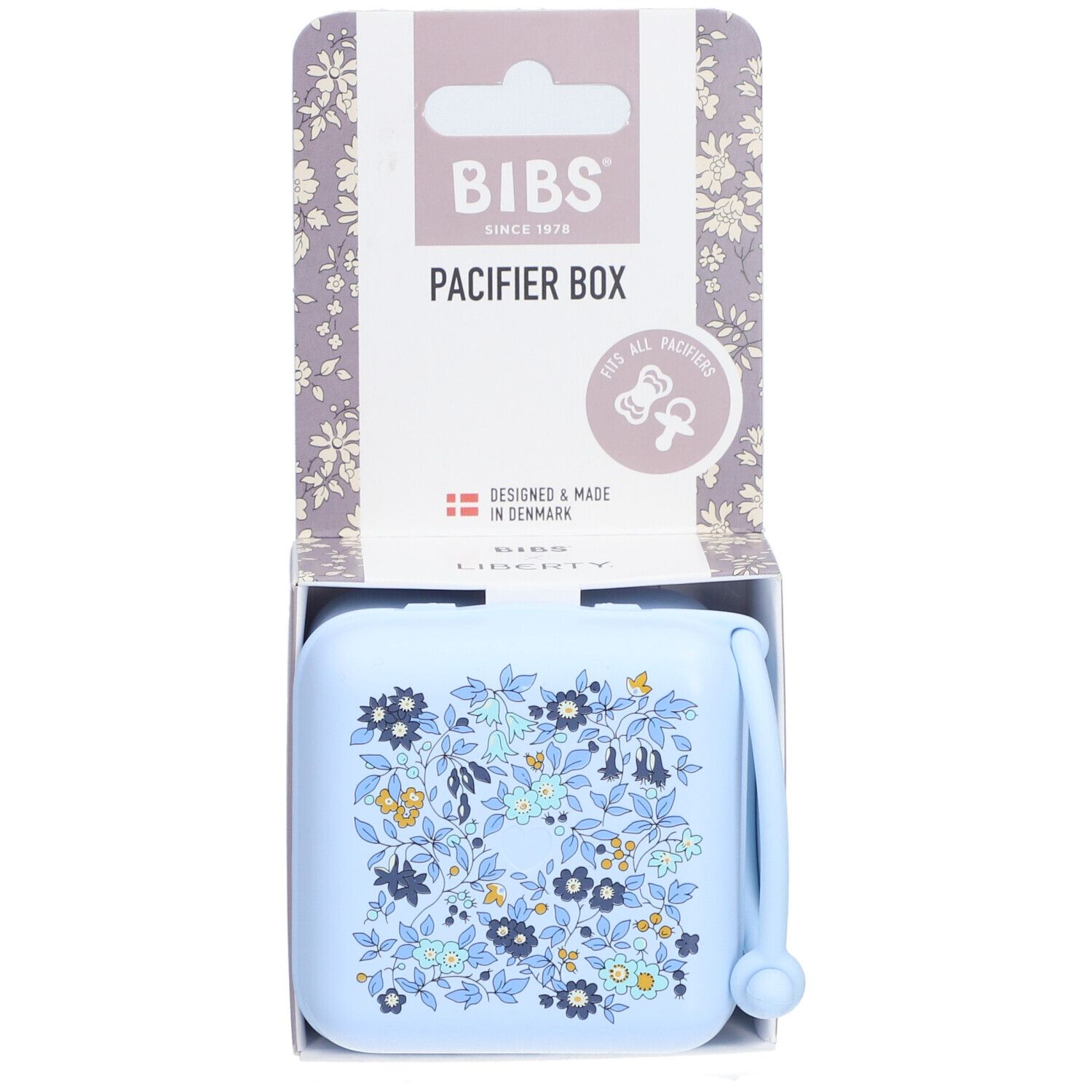 BIBS Schnullerbox Liberty Blue. Hellblaue Box mit Blumenmuster. Verpackung mit BIBS-Logo und Produktbezeichnung.