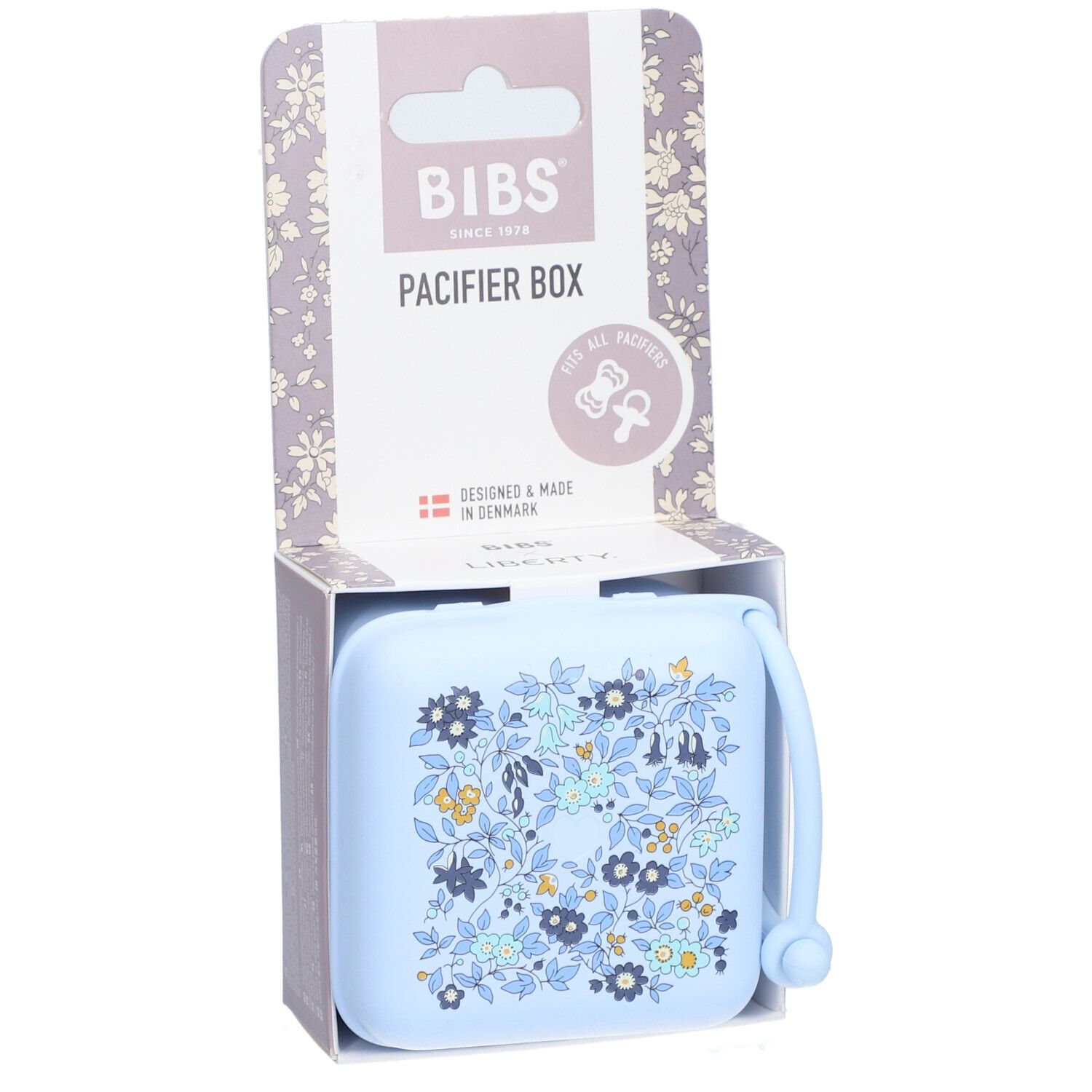 BIBS Schnullerbox Liberty Blue. Hellblaue Box mit Blumenmuster. Verpackung mit BIBS-Logo und Produktbezeichnung.