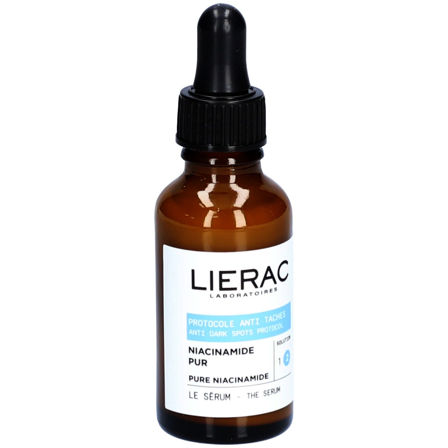 Flacon en verre brun avec pipette noire. Étiquette avec informations produit. Marque : Lierac.