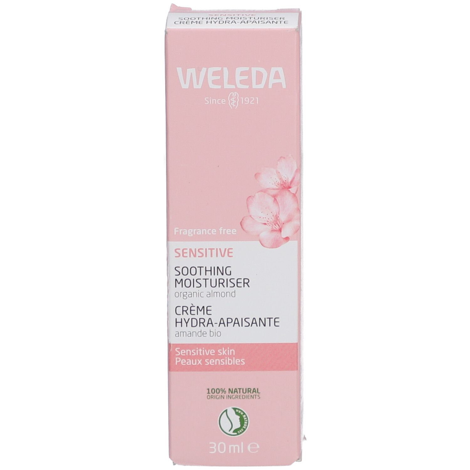 Rosa Schachtel. Aufschrift: WELEDA, SENSITIVE, SOOTHING MOISTURISER, CRÈME HYDRA-APAISANTE. 30ml. Mit Blüten.