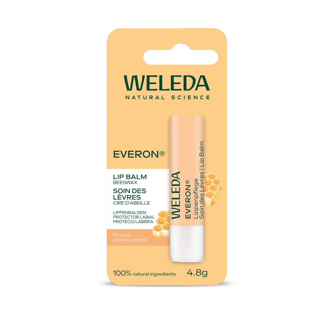 Weleda Everon® Lippenpflege in Verpackung. Gelbe Karte mit Produkt und Bienenwaben-Illustration.
