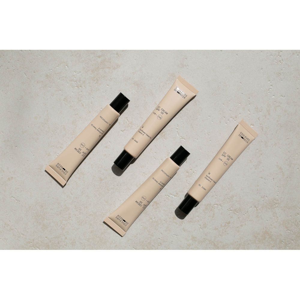 Plusieurs tubes beiges avec bouchon noir. Marque: Couleurs de Noir.