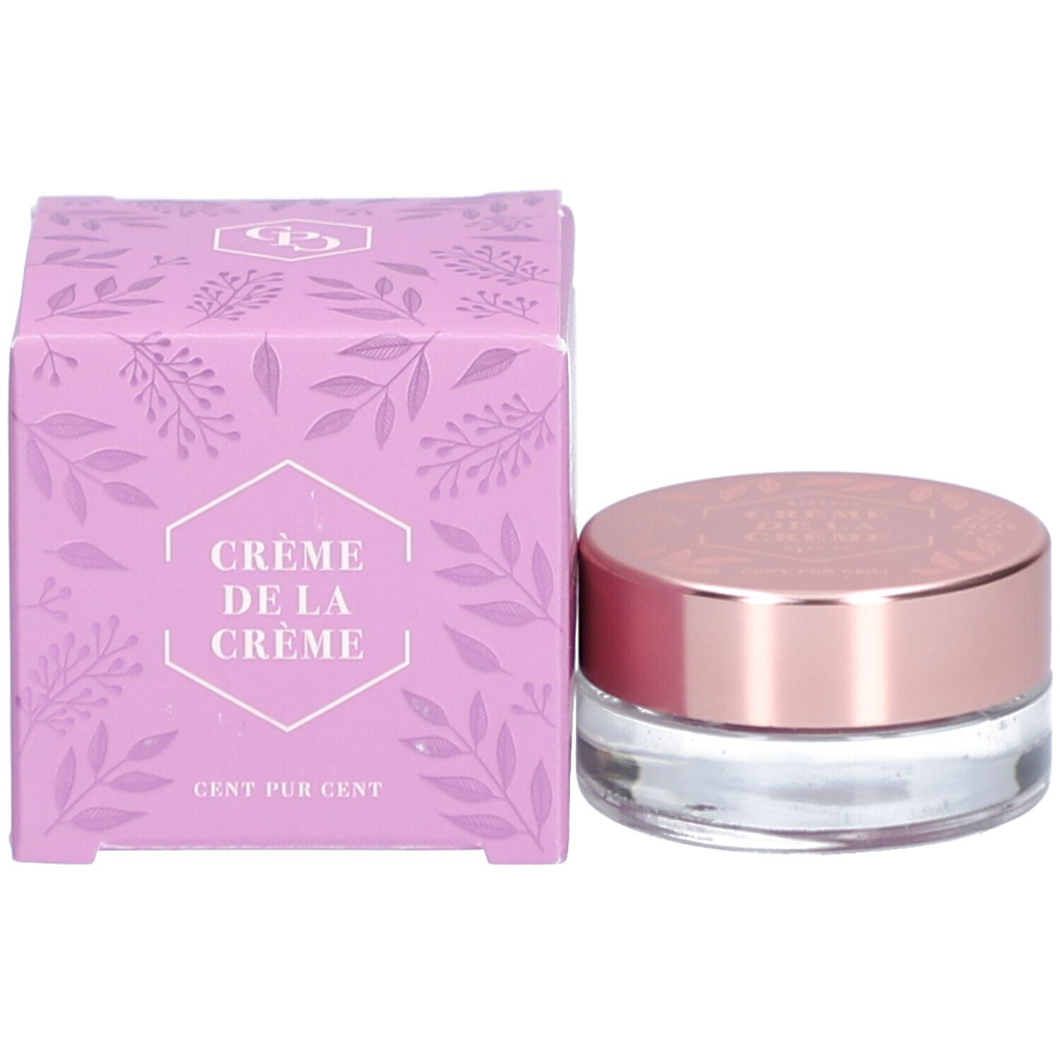 Crème lila dans un pot en verre avec un couvercle en or rose et une boîte assortie. "Crème de la Crème" est écrit sur la boîte.