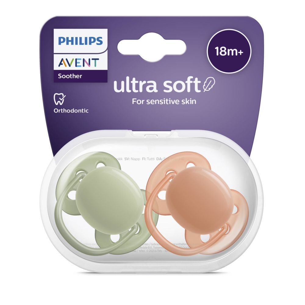 Emballage avec deux sucettes. Vert et orange. Texte: PHILIPS AVENT, Ultra Soft, 18m+. Boîte de rangement transparente.