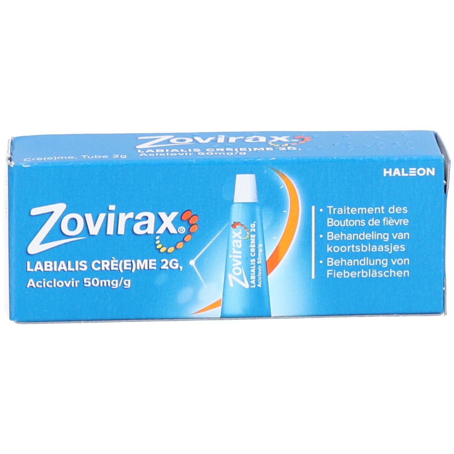 Blauwe doos met productnaam en afbeelding. Tekst: Zovirax Labialis Crème 2g, Aciclovir 50mg/g.