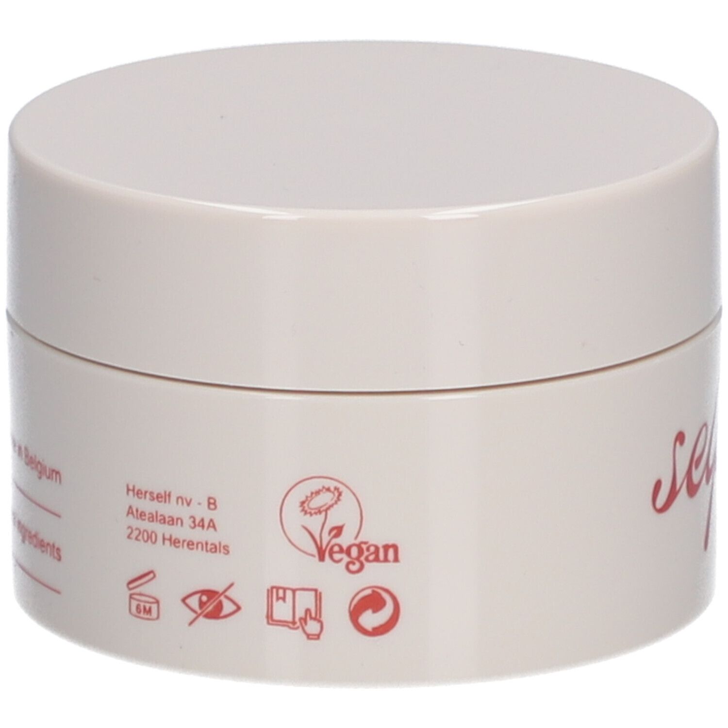 Beige Tiegel mit Aufschrift. Vegan-Siegel. Text: Herstelt nv-B, 2200 Herentals, Belgien.