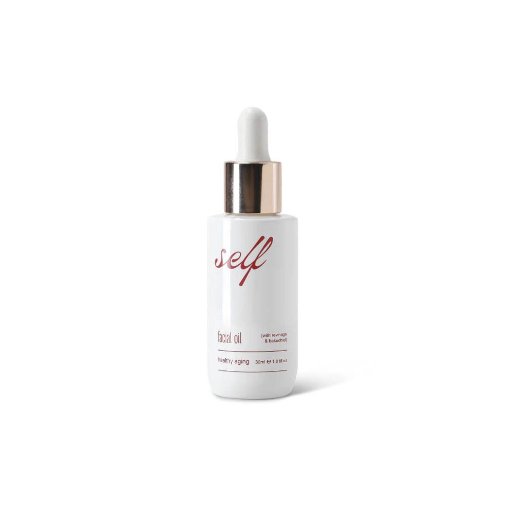 Flacon blanc avec pipette. Inscription "self facial oil healthy aging".