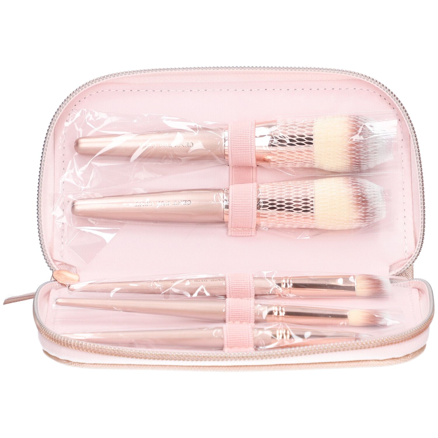 Roze make-up kwastenset in een roze etui. De kwasten zijn verpakt in plastic en vastgezet met roze linten.