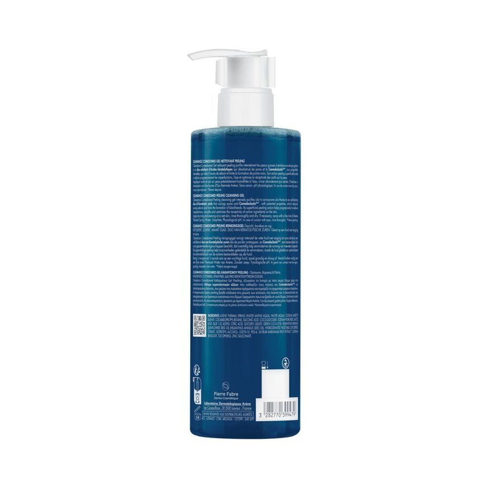 Dos du flacon avec informations produit. Liquide bleu visible. Texte en plusieurs langues.