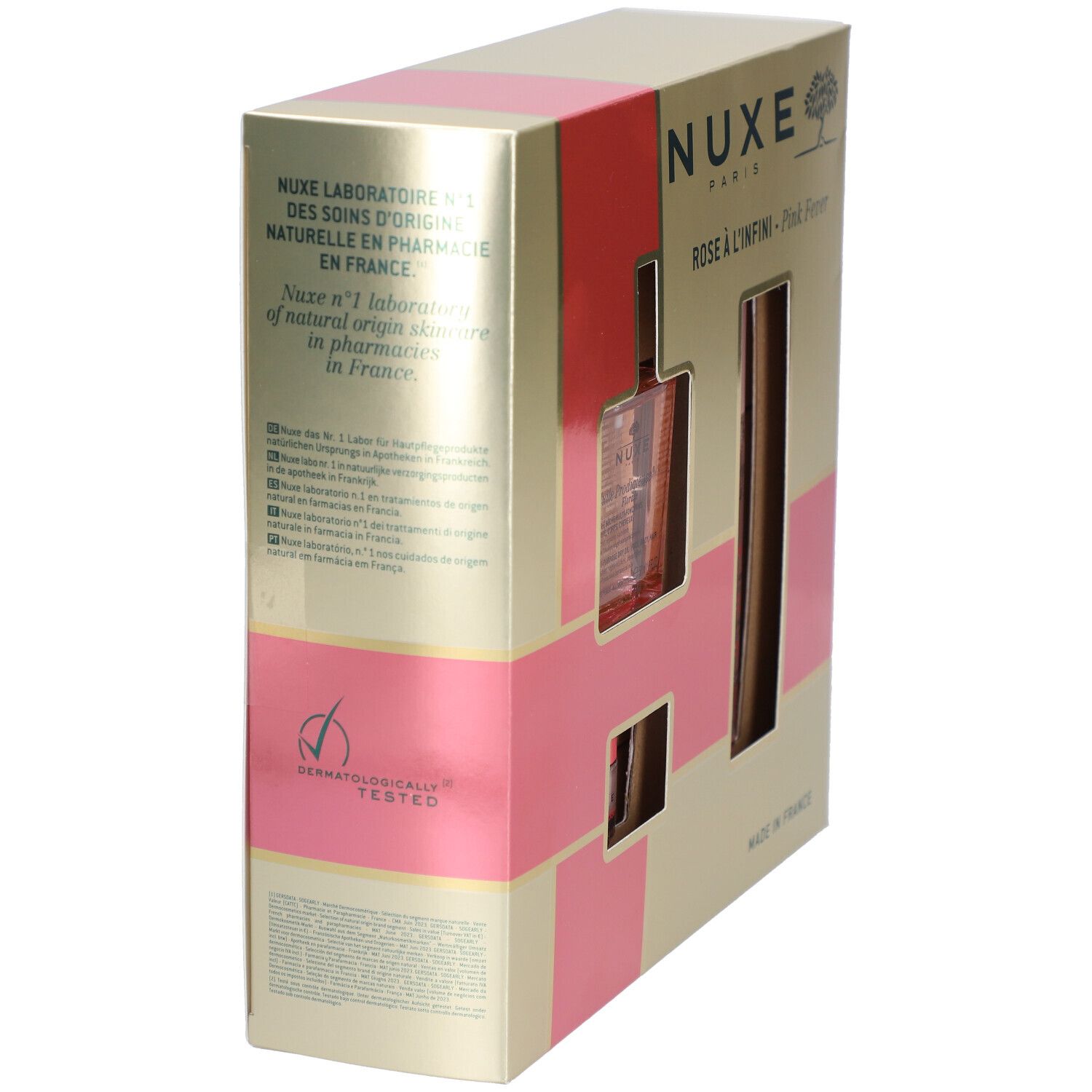 Boîte cadeau dorée avec rayures roses. Logo Nuxe et noms de produits. Inscription 'Made in France'.
