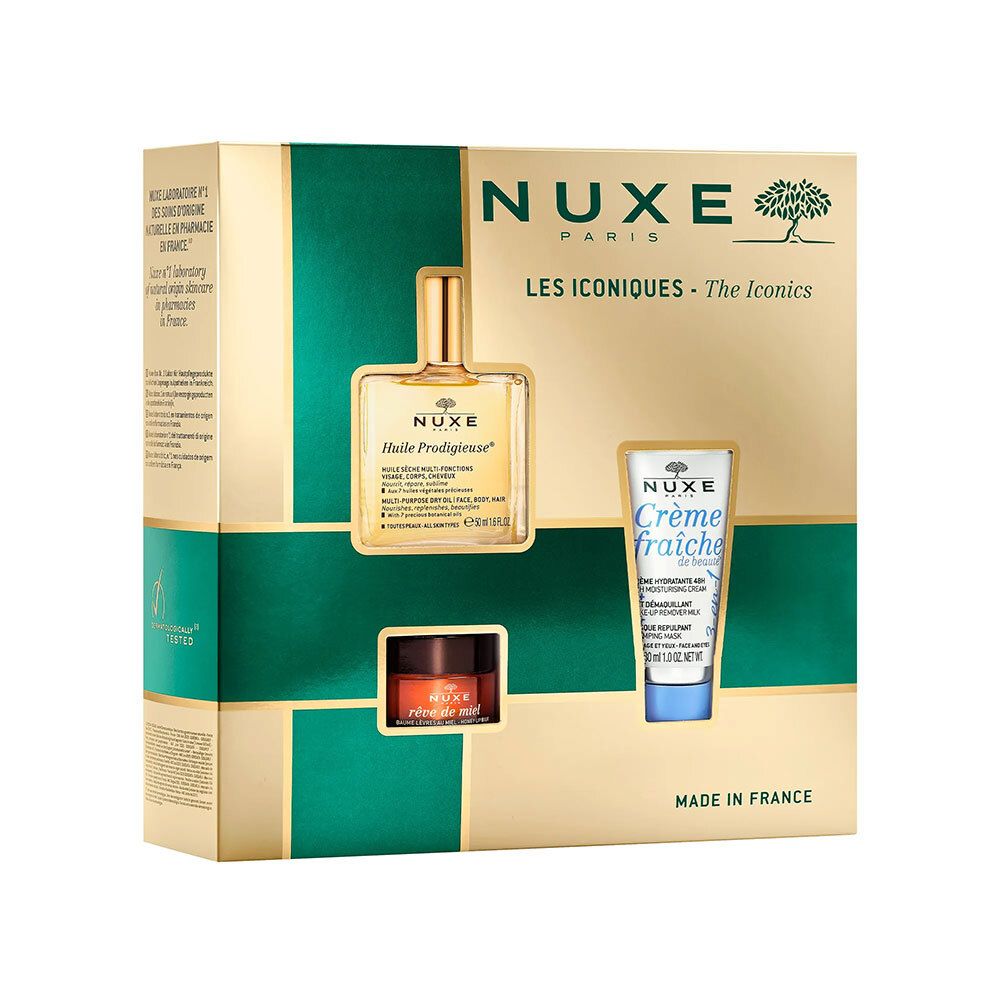 Coffret cadeau avec trois produits. Emballage doré avec ouvertures. Logo Nuxe et noms de produits visibles.