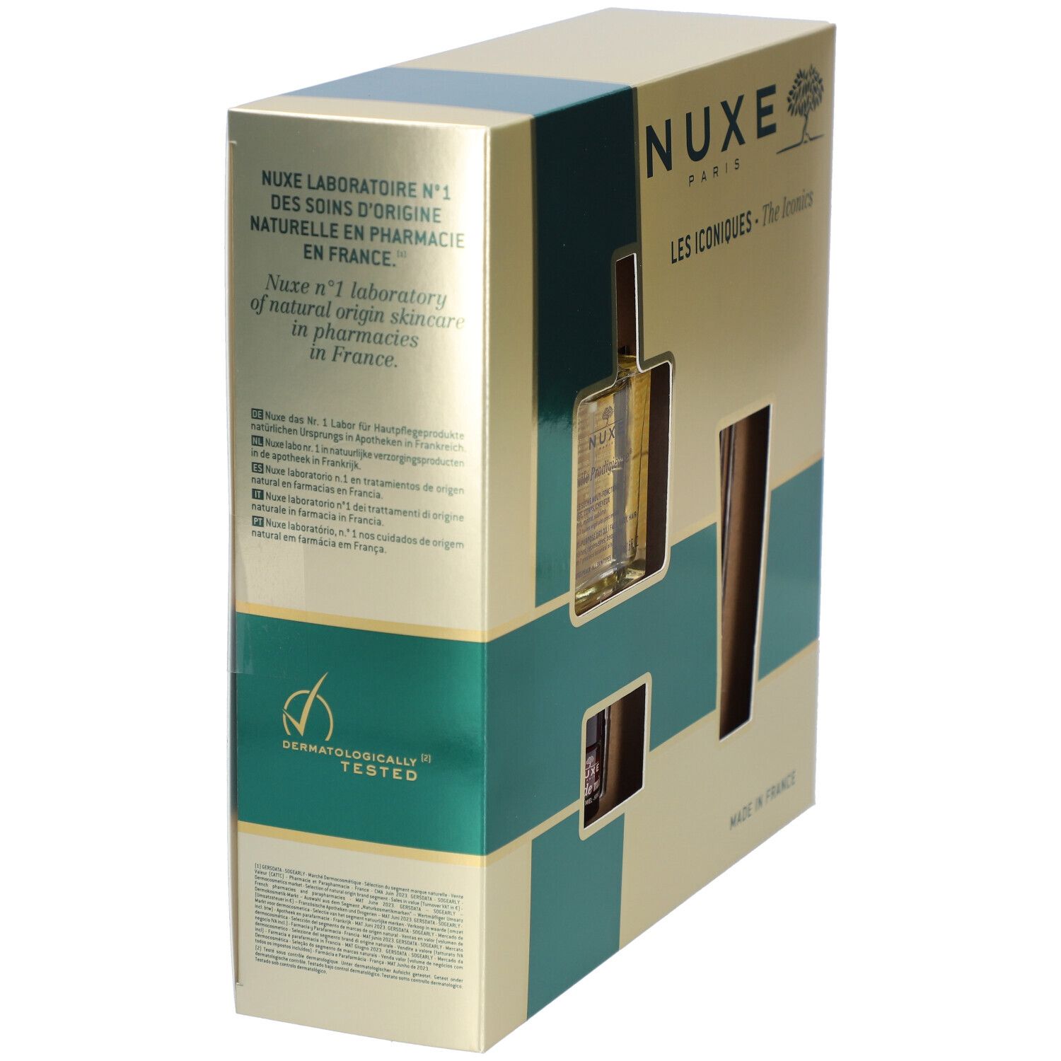 Boîte cadeau en biais. Doré avec des accents verts. Logo Nuxe et noms de produits sur le devant. Testé dermatologiquement.