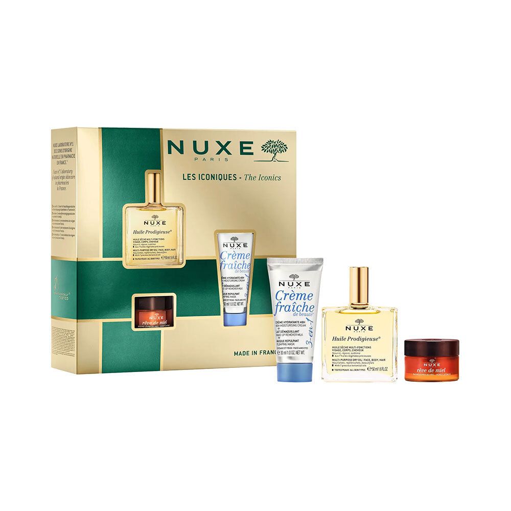Coffret cadeau avec quatre produits. Emballage doré avec ouvertures. Logo Nuxe et noms de produits visibles.